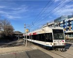 A westbound crosses 19th Street in Weehawken located just south of the Lincoln Harbor Station