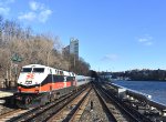 Metro North Train # 865, with Connecticut Department of Transportation owned P32AC-DM # 229 in the original New Haven Railroad colors, leads northbound Metro North Train # 865 past the Spuyten Duyvil Station