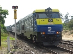 Train 8707 heads west past the WH block limit signal