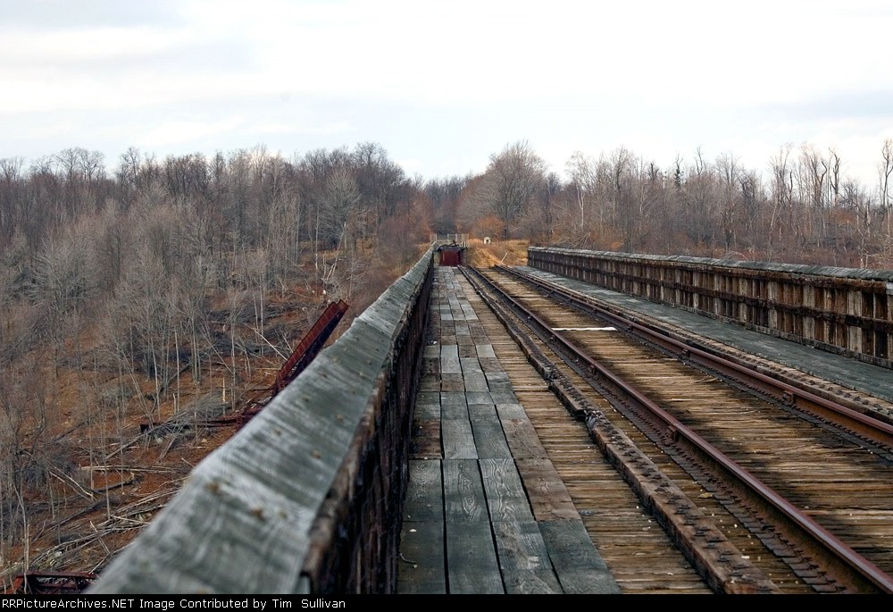 The bridge deck looks safe, but watch that last step. It's 300 feet straight down!