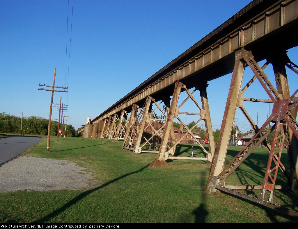 Depot and Old Caboose Visible under the Bridge