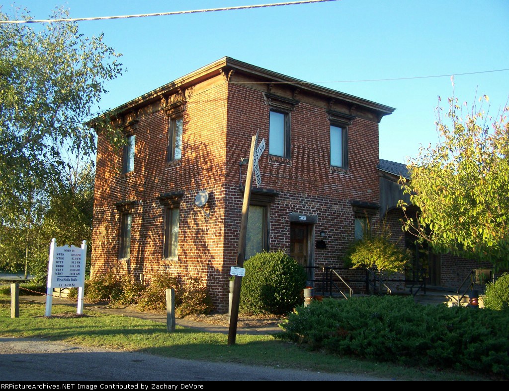 Old RR Crossing Sign in front of old Freight Station