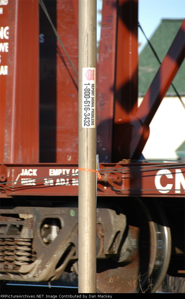 WC sticker on crossing sign