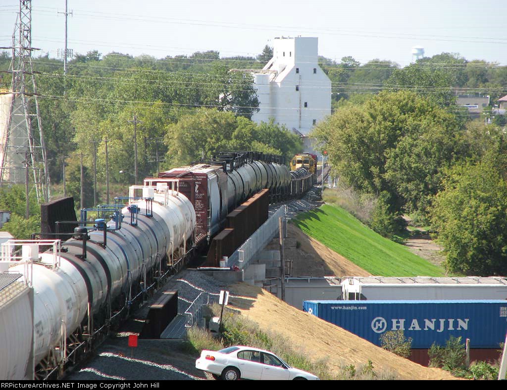 070911027 A long westbound CP freight crosses the new CP/SHO bridge over BNSF Northtown