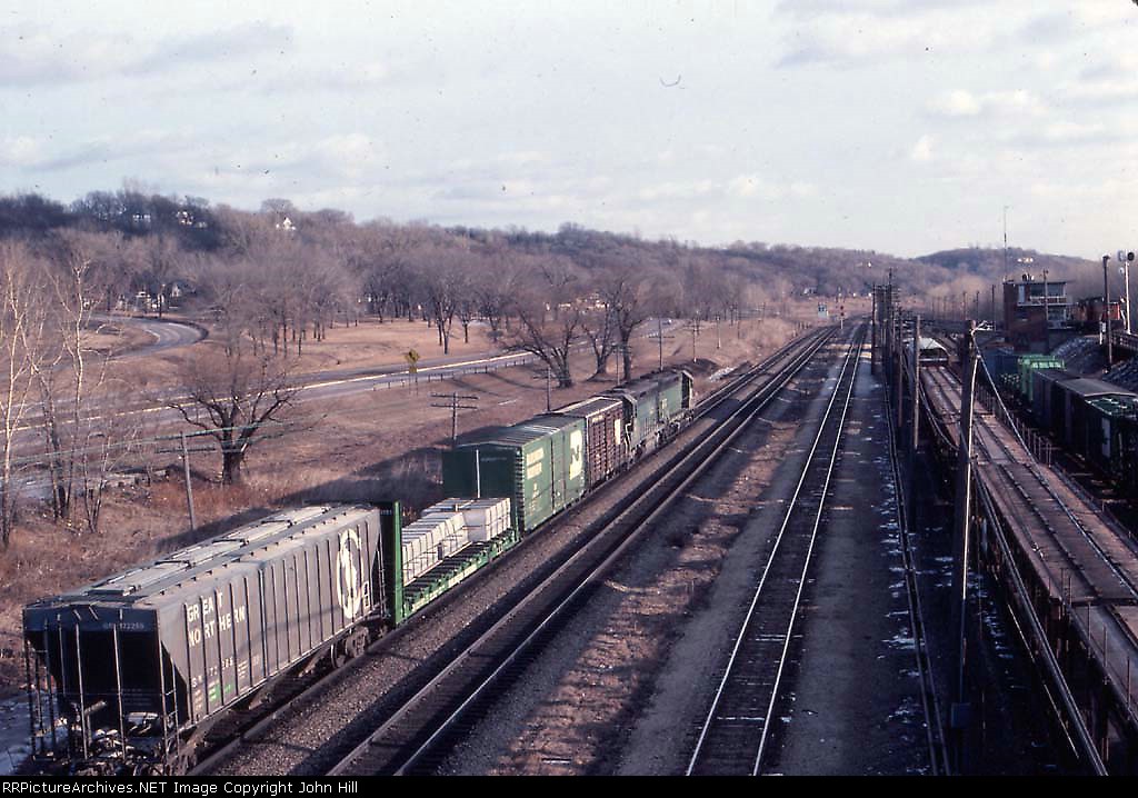 1036-16 Eastbound BN freight passes Daytons Bluff Yard near Oakland Tower