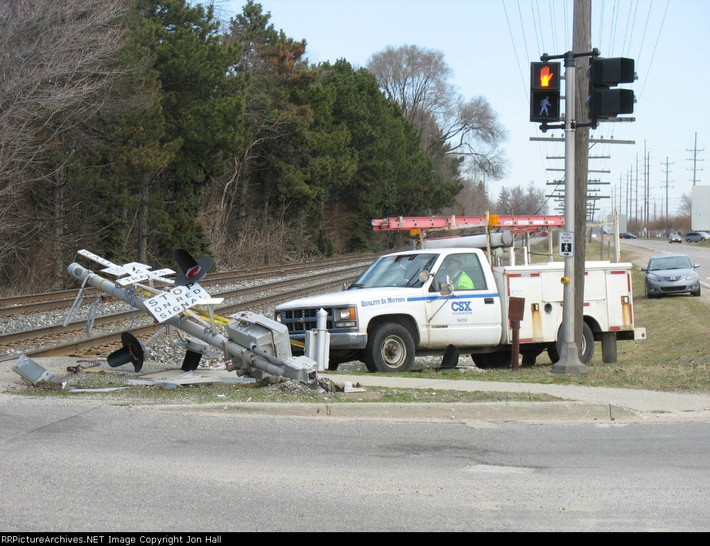With a train just around the corner, brute force is used to clear the ROW