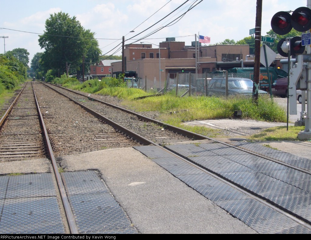 No platform (other than the paved surface at right) or covered waiting area