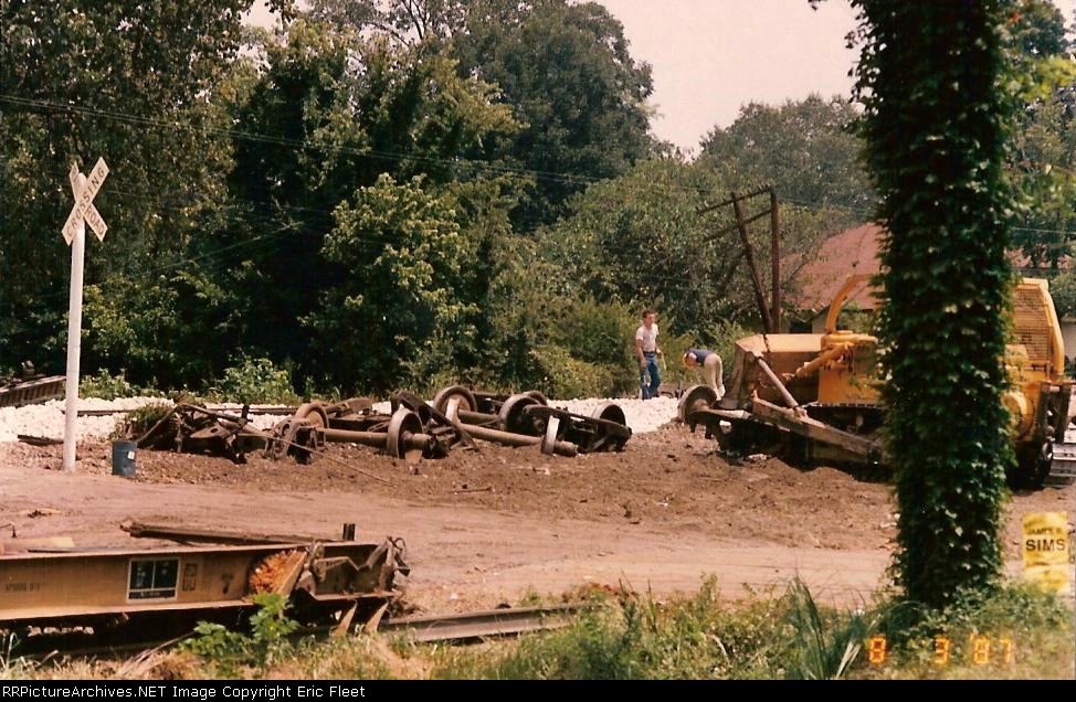 BN Freight train, milk tanker collide; trucker spared.