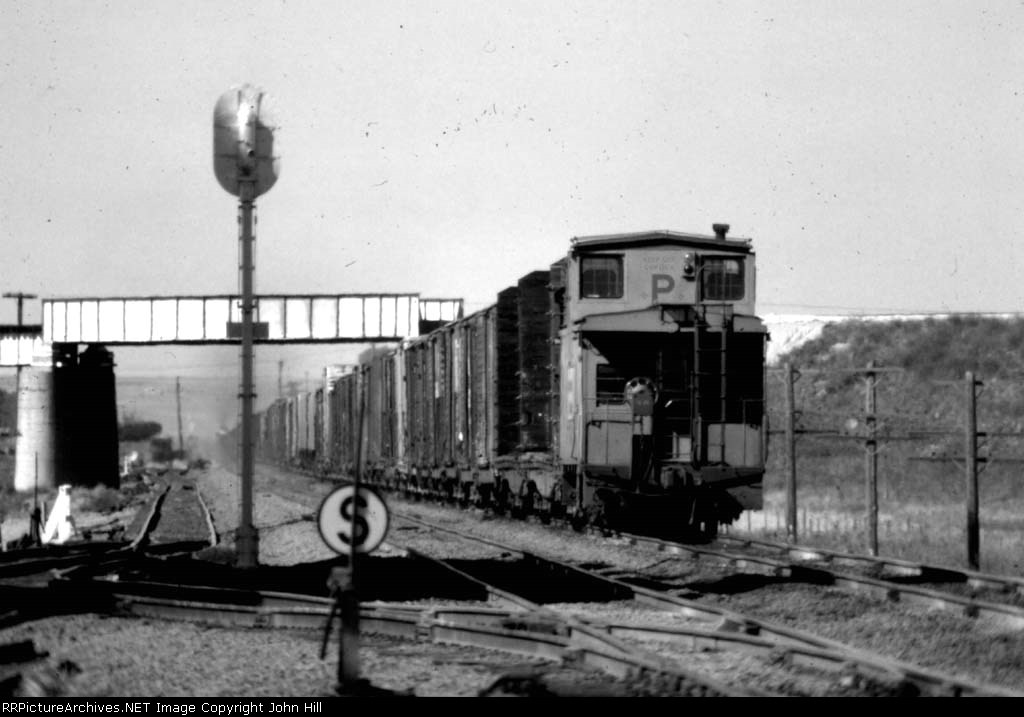 1091-23 Eastbound UP freight passes under BN bridge