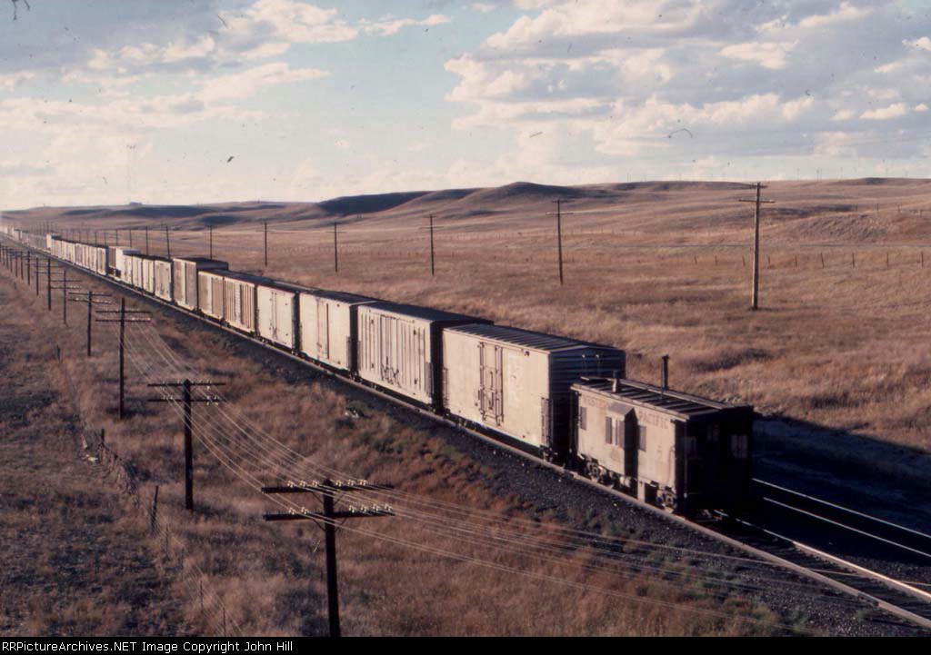 1100-22 Westbound UP freight with WP caboose