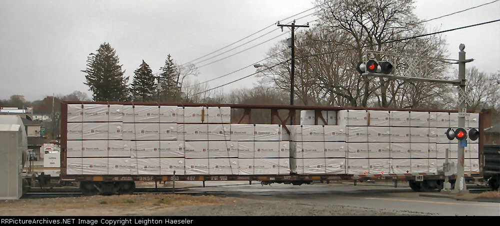 BNSF 563487 with Plum Creek wrapped building material load