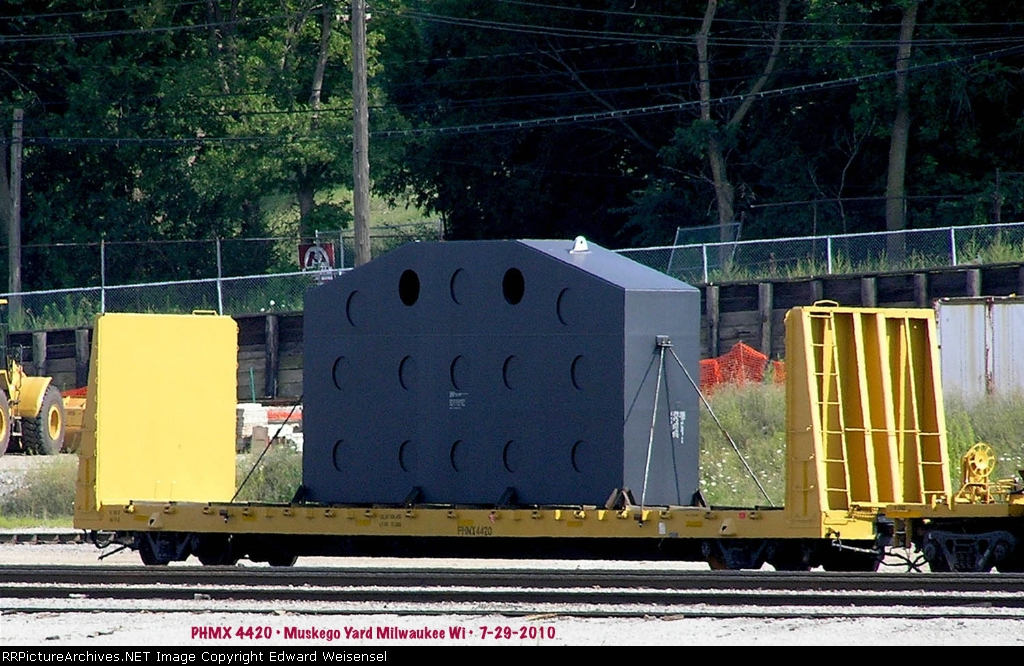 P+H Harnischfeger component rides a company bulkhead flat