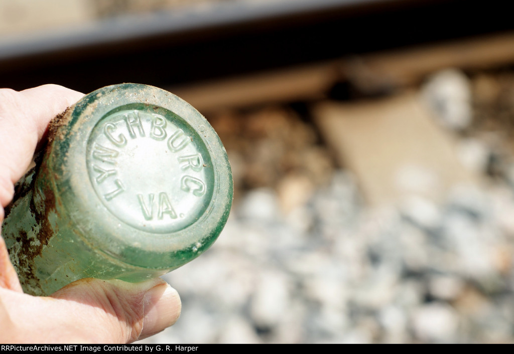 647 - while waiting for the H744 to appear I came across this broken Coke bottle buried in the dirt near my photo location