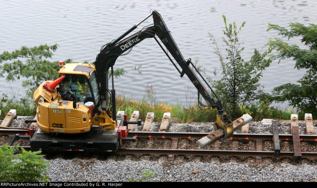 In the back yard again. Concrete tie grabber moves the discarded concrete ties out of the way to make room for the tried-and-true hardwood tie replacements