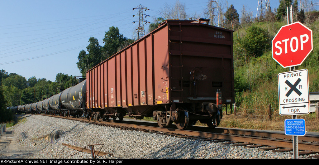 Rear buffer car on oil train K08025 eastbound