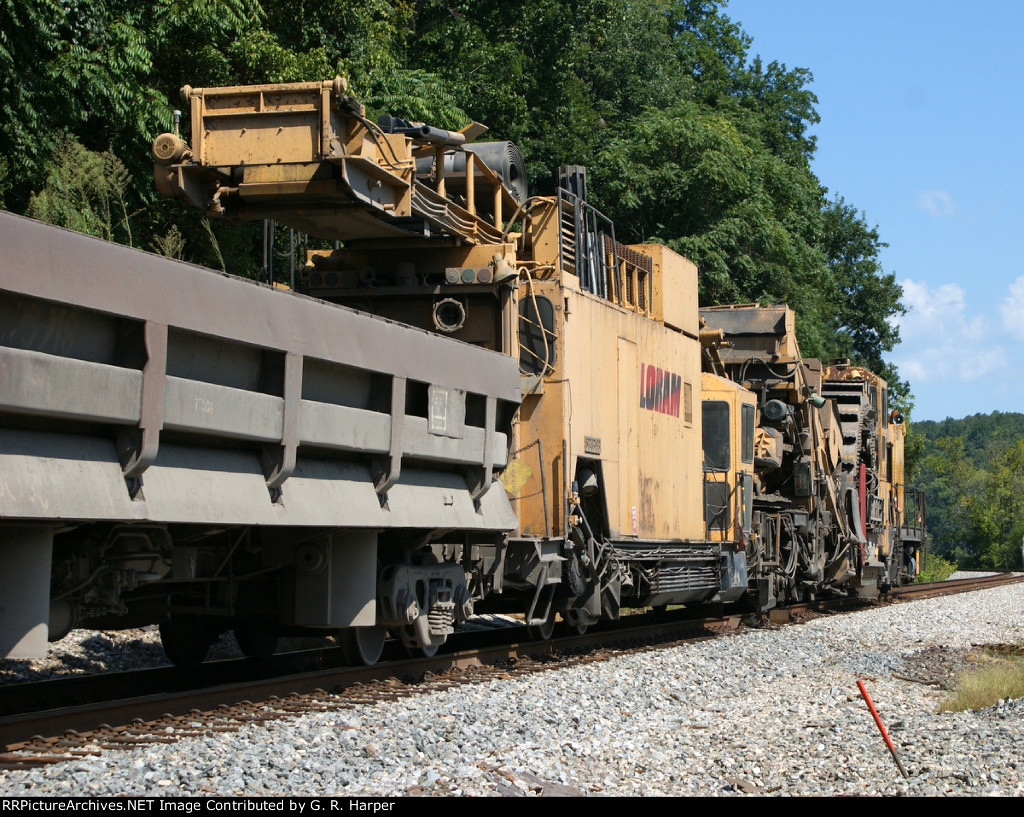 Going away shot of the Loram ballast end cleaner heading west to do some work between Reusens and Pearch on the James River S-D