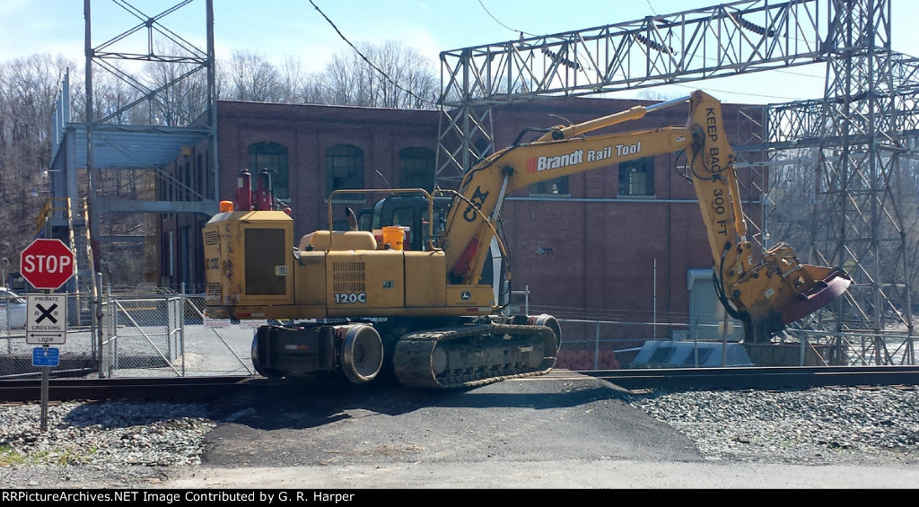 After a nice chat the operator of the bush hog climbs back onto the rail to go back to work.