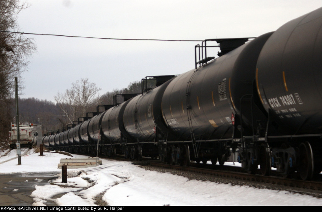 724 - CSX signal maintainer has arrived at the Reusens defect detector as the K08014 oil train trundles eastbound