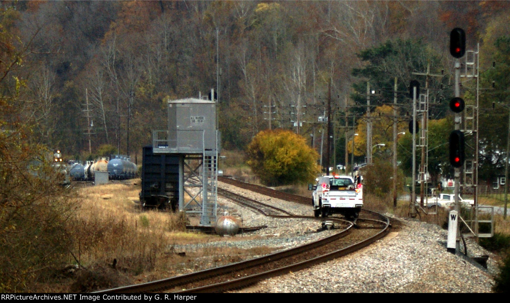 Track inspector gets out of the way of the B01213 waiting to go west
