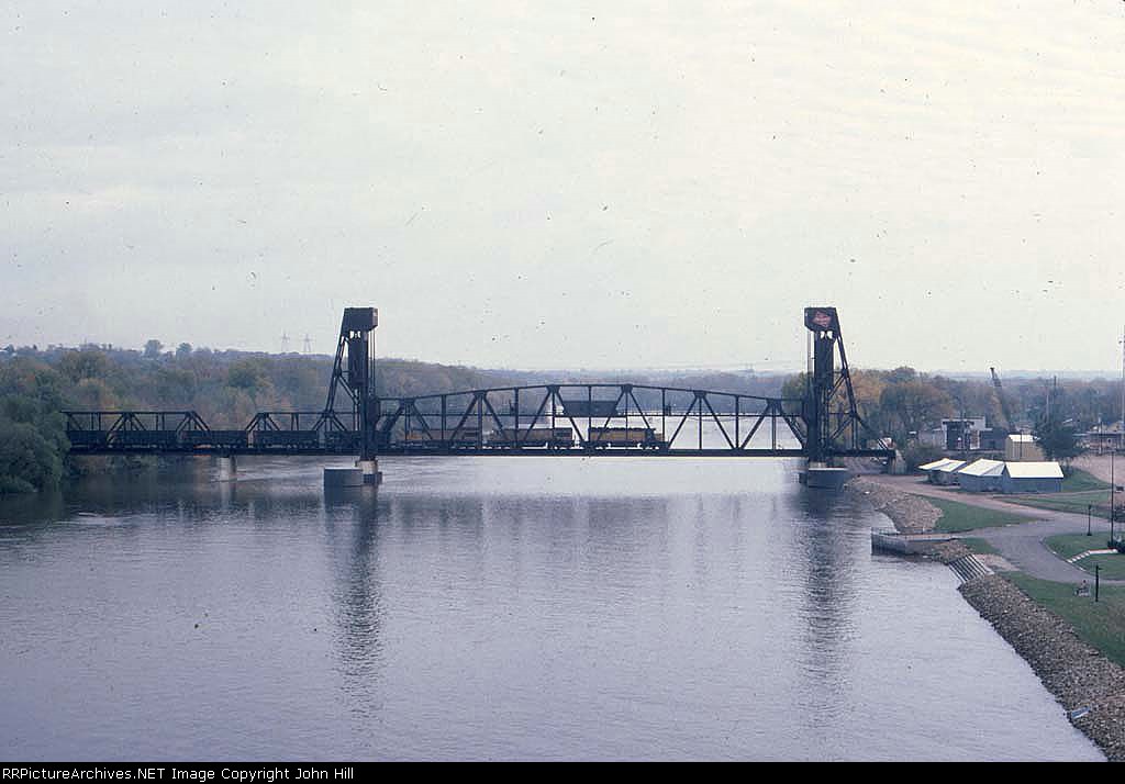 1382-19 Eastbound CNW coal train crosses MILW Mississippi River lift bridge