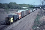 1333-37 Eastbound C&NW freight passes abandoned Koppers Coke site on BN/ex-GN between Snelling and Lexington