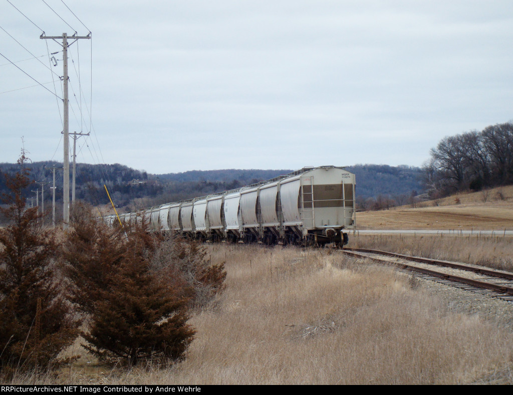 String of covered hoppers stored on the Sauk Branch along Highway 78
