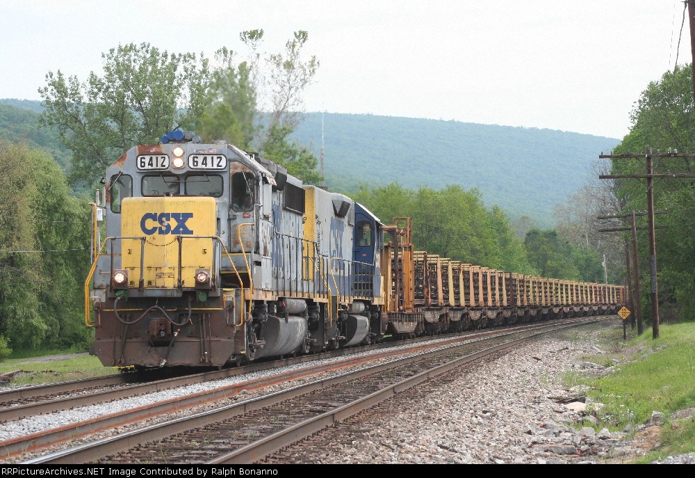 A pair of old work horses power a loaded rail train, heading for the grade  up and over the hills via Sand Patch
