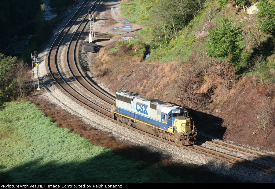 SD50 # 8550 Drifts eastward down the grade  on # 2 track to await its next assignment