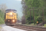 A westbound empty hopper train enters town and is about to start up the long climb to Sand Patch