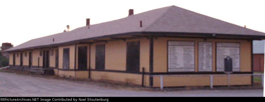 East end of South wall of depot