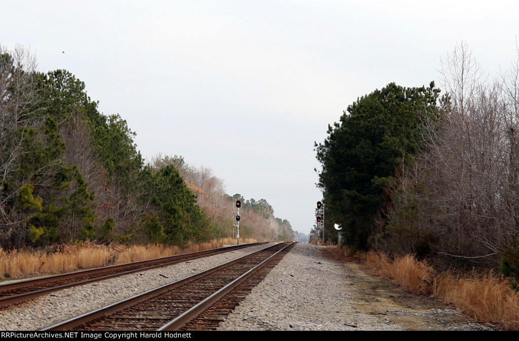 The approach lit signals are on! Track 1 (left) is for train Q400 while track 2 (right) is for train Q470, already in the block