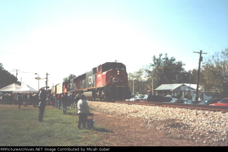 A North bound CN train pass through Ridgeland as a crowd awaits for the IC passenger train
