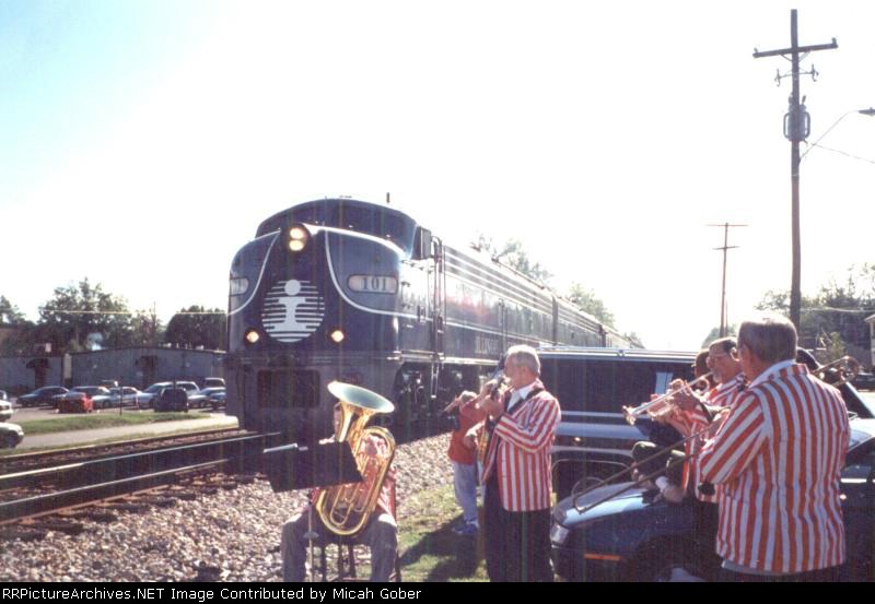A band plays a the old Illinois Central Passenger train makes a stop in Madison, Mississippi