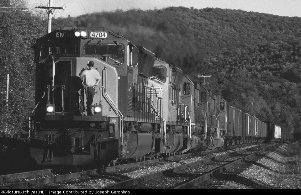 NYS&W Q404 conductor Cory Farber makes a call to the NYS&W dispatcher on the satelelite phone 6/2005