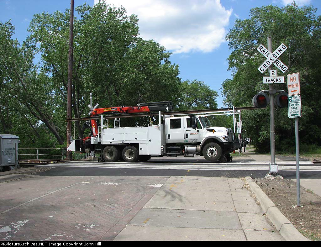 080624018 BNSF high-rail truck sets itself off on Nicollet Island on Auxiliary track on Wayzata Sub