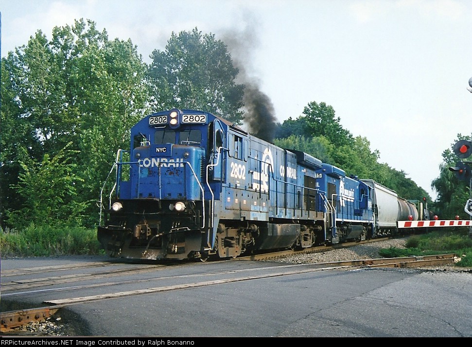 B23-7s 2802 and 1915 hustle the Kingston local north at MP 21 on the River Line