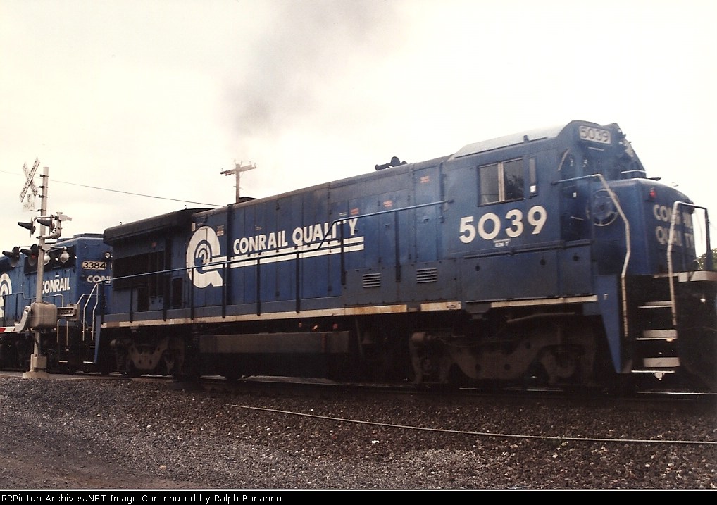 B36 # 5039 smokes it up as it rolls east through CP- BURN