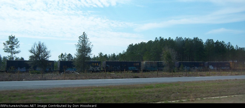 East of Pearson there are several miles of cars stored on an old line along Highway 82