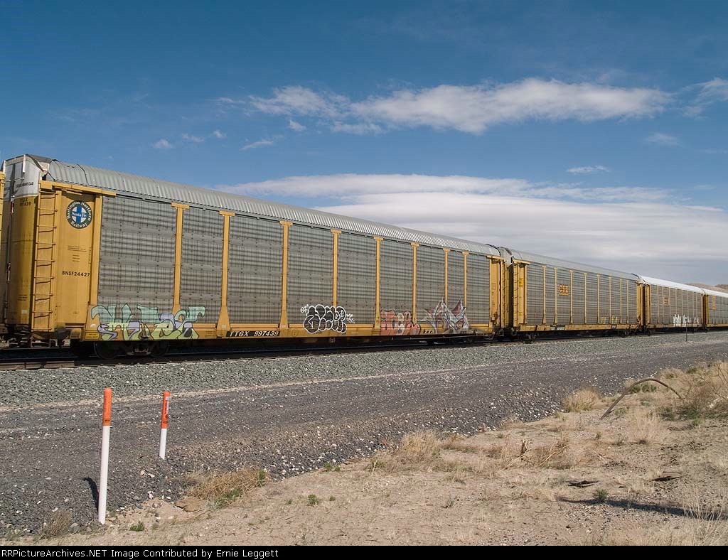 TTGX 997439 in an EB autorack passing a WB manifest at 2:56pm