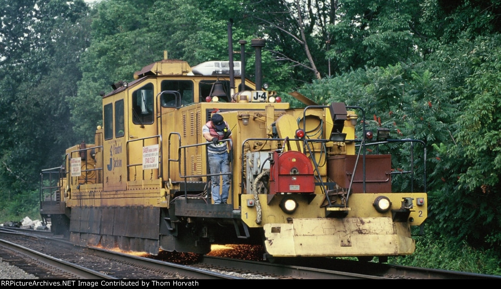 Pandrol Jackson's J-4 rail grinder is grinding rails near LEHL MP 66