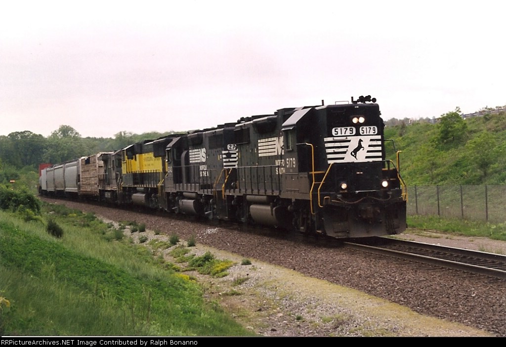 Train 258, with 2 GP38's, an SD70, and a GE Super 7 work their way east
