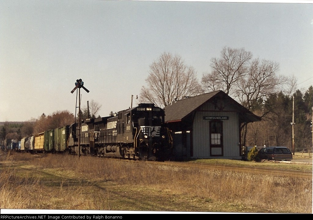 A late afternoon Hanjin train, with some freight added , passes the classic station, rolling eastward