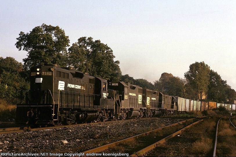 Penn-Central EMD GP-9 7182, along with a GP-38-2, GP-40 and a GP-7, leads a boxcar freight north on the River Division