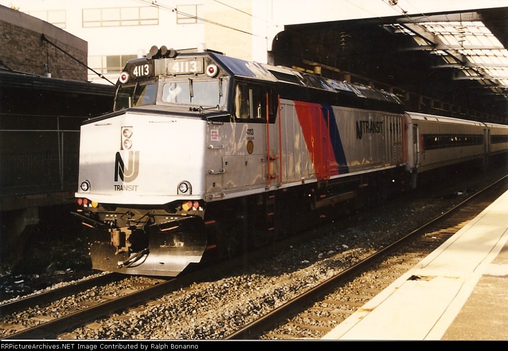 F40 4113 departs Penn Station bound for  the Raritan Valley Line