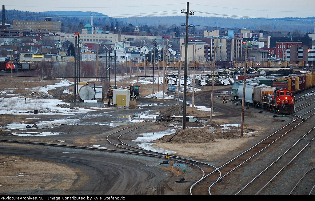 1555 Neebing Job switches the yard a CN 436 prepares to depart off of TC 92. Note the deer in the foreground of the shot