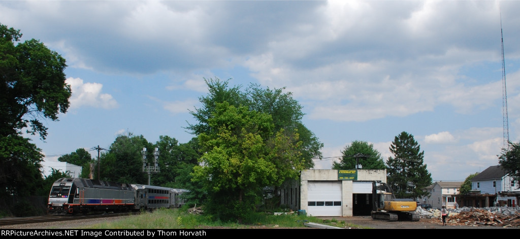 NJT train 5179 heads west past the demolition site for a new apartment complex