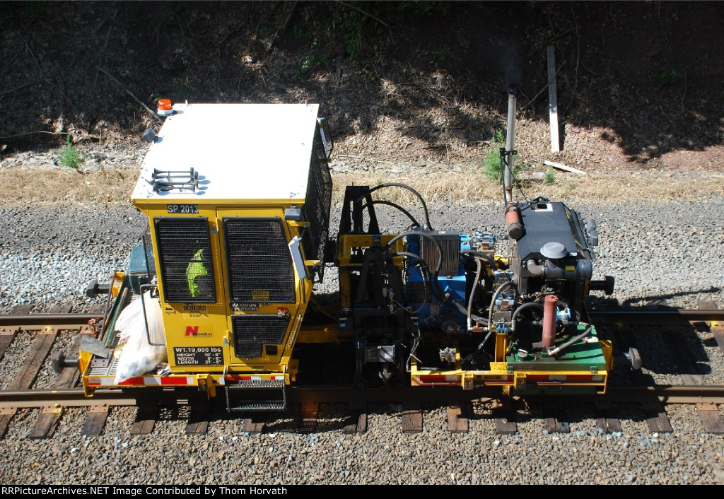 NJT's SP 2013 is seen pulling spikes for tie rkplacemnet on the RVL