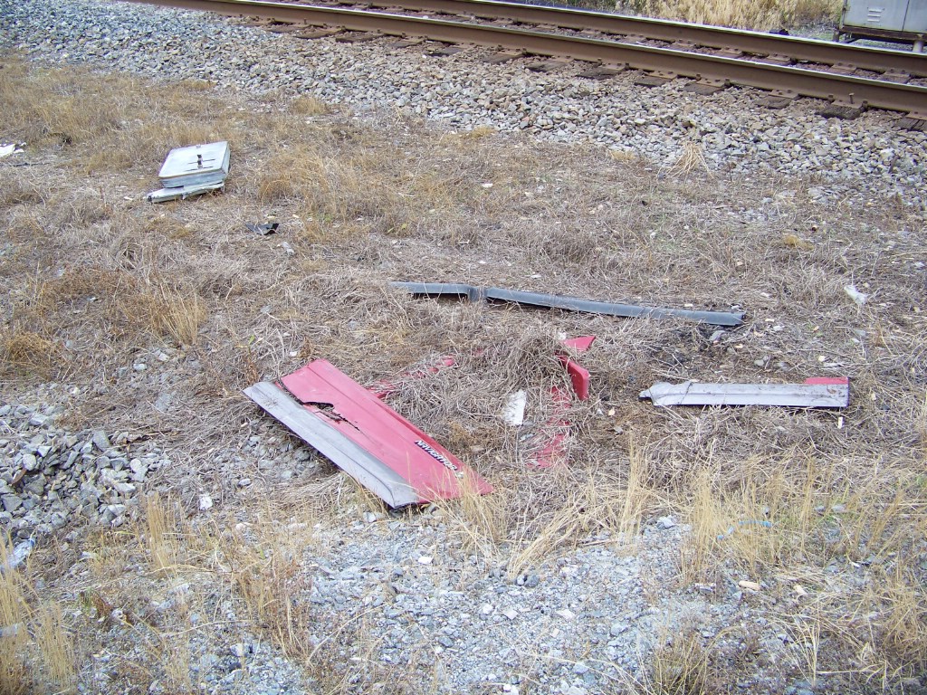 Pieces of the other truck that has wiped out this same crossing gate