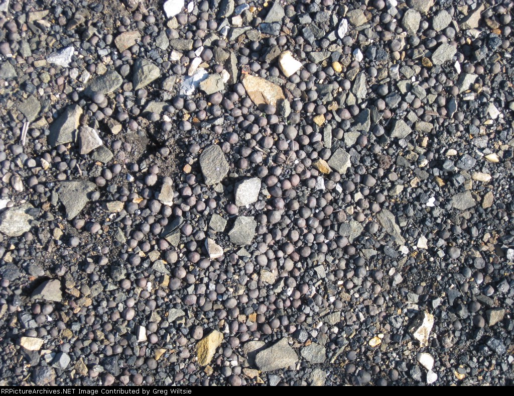 Iron Ore Pellets on the ground in RJ Corman yard