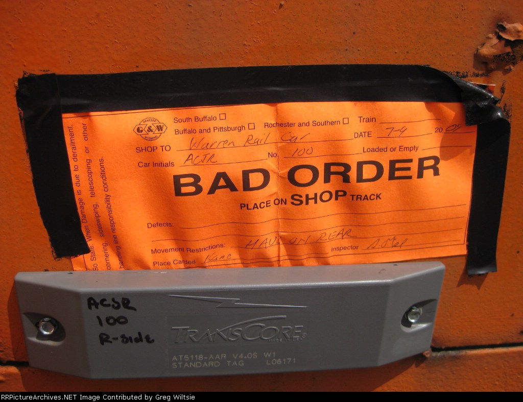 A Genesee and Wyoming Bad Order tag is seen on on of the old Knox and Kane cars